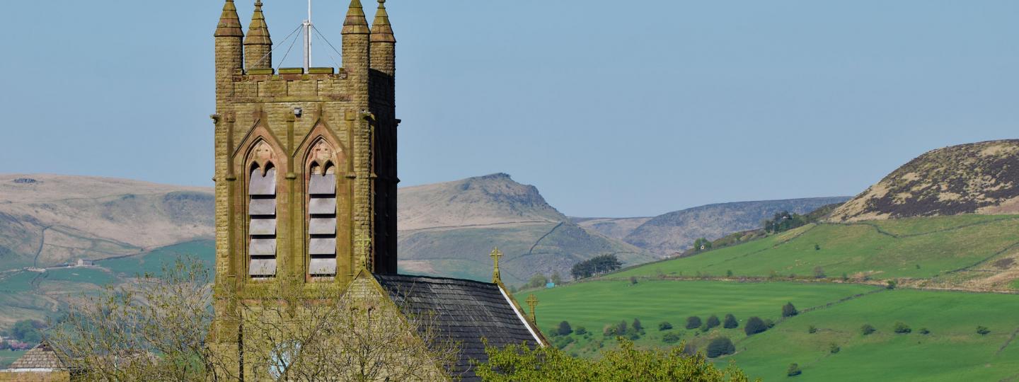 Photo of church and hills in the background