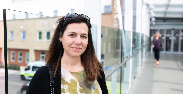 Women standing outside hospital 